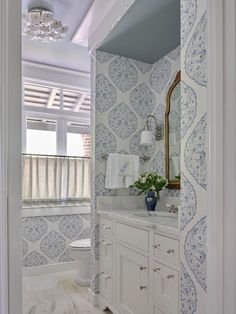 the bathroom is decorated in blue and white