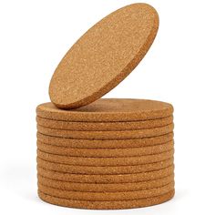 a stack of round cork coasters on a white background