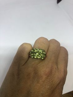 Rich and very bright Peridot green ring Sterling silver with gold rhodium finish Size 8 can be sized by my jeweler. His service charge is $10 All rings are shipped in a nice gift box. Check out our over a THOUSAND great reviews Engraving is $4 per letter and is not always perfect depending on the piece. It can take a few days if the jeweler is busy. This is payable to Paypal Judithsltd@gmail.com Unique Green Emerald Anniversary Ring, Green Peridot Crystal Ring With Gemstone, Green Peridot Rings For Anniversary, Green Peridot Gemstone Crystal Ring, Green Peridot Crystal Ring, Unique Green Crystal Ring In Sterling Silver, Unique Green Sterling Silver Crystal Ring, Unique Green Crystal Promise Ring, Green Crystal Ring For Anniversary, May Birthstone