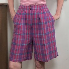 "Vintage Plaid Bermuda Shorts by L.L. Bean, 1980s High Waist Cotton Shorts in Pink & Purple Plaid, Size Medium 100% cotton shorts in fuchsia, amethyst, with hints of blue and chartreuse. These high waisted shorts are about knee length and have a wide and full leg. The waistband is tailored and has belt loops, with two buttons at the waist band and a zipper closure. Generous on-seam pockets at each hip. These shorts are in excellent condition and have no issues - no rips, stains, or other condition problems. Preppy, academia type of style, classic L.L. Bean. These are marked size 12, but measure more like a modern size medium or 8. For best fit, please compare the measurements below to your own, or to the size chart of a brand that fits you well. Waist: 29\" Hips: 46\" Waist to hem: 22\" In Blue And Chartreuse, Bermuda Shorts Outfit, Dad Shorts, Preppy Academia, Purple Plaid, Shorts Outfit, Vintage Plaid, Plaid Shorts, Clothing Care