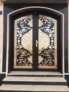 an ornate glass door on the side of a building