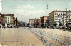 an old photo of a city street in the early 20th century