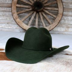 Introducing the Pine Cowboy Hat by Serratelli Hat Company, a genuine American-made accessory tailored for the modern cowgirl or cowboy. Crafted from 2X wool with a 4.25-inch brim and long oval crown, it offers both style and comfort. The satin lining and leather sweatband ensure a luxurious feel, making it the perfect blend of fashion and function. Elevate your western-inspired look with this chic and versatile piece. 4 1/4" Brim 4 3/16" Crown Color: Pine 2X Wool Made in the USA Long Oval Western Riding Hats For Winter, Western Riding Hat With Curved Brim, Country Style Felt Hat With Curved Brim For Rodeo, Country Style Curved Brim Felt Hat For Riding, Fitted Wool Hat For Ranch, Country Style Flat Bill Hats For Rodeo, Winter Riding Adjustable Hat, Adjustable Winter Riding Hat, Western Brimmed Riding Hat