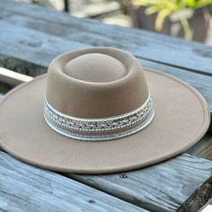 These wide brim hat exudes rustic sophistication to carry out western cowgirl looks woven with hints of chic bohemian style. The felted fedora hat is equal parts comfortable and fashionable. size adjustable 90% polyester, 5% cotton, 5% wool height: 4 ½” circumference: 24” brim width: 3 ½” Western Wide Brim Hat In Natural Color, Handwoven Bohemian Wide Brim Fedora, Bohemian Cream Wide Brim Felt Hat, Cream Bohemian Brimmed Felt Hat, Western-style Handwoven Wide Brim Sun Hat, Cowgirl Look, Bohemian Chic Fashion, Mens Items, Western Cowgirls