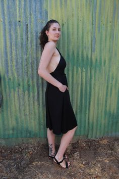 The Monroe dress is one of our most versatile fits for many different bodies as it is double adjustable. It wraps around the waist and also halter ties at the neck making it form to your body perfectly. You can make the straps more sexy by tying knots or twisting as shown in the photos. Big side seam pockets that don't add bulk. Double lined bust so you can wear it without a bra and not be too nippily. Open back that is super sexy. Can we warn with a long sleeve underneath on chillier days. Made Chic Halter Neck Dress With Built-in Bra, Fitted Midi-length Backless Dress With Tie Back, Backless Midi Dress With Built-in Bra For Date Night, Black Backless Dress With Tie Straps, Sundress With Built-in Bra For Date Night, Fitted Summer Backless Dress For Night Out, Chic Halter Dress With Spaghetti Straps And Back Opening, Fitted Strappy Back Dress For Casual Wear, Strappy Back Sundress For Date Night