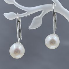 This simple but absolutely elegant earrings are made with freshwater cultured pearls that are an outstanding AA+ quality. They have been mounted on sterling silver lever back earrings. The pearls are slightly over 7mm in diameter. Freshwater Cultured Pearls, Elegant Earrings, Cultured Pearls, Fresh Water, Pearl Earrings, Sterling Silver, Silver