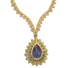 Stamped: 14K Yellow GoldTotal Necklace Weight: 21.7 GramsNecklace Length: 17 InchesNecklace Width: N/AGemstone Weight: Total Natural Tanzanite Weight is 6.56 Carat (Measures: 15.10x10.52 mm)Color: BlueDiamond Weight: Total Natural Diamond Weight is 10.11 CaratColor: F-G, Clarity: VS2-SI1Face Measures: 20.10x16.20 mmSku: [703024W] Luxury Tanzanite Necklaces For Anniversary, Luxury Tanzanite Necklace For Anniversary, Gold Pear-shaped Gemstone Diamond Necklace, Gold Diamond Necklace With Pear-shaped Gemstone, Gold Pear-shaped Diamond Necklace With Gemstone, Yellow Gold Pear-shaped Hallmarked Necklace, Hallmarked Pear-shaped Yellow Gold Necklace, Fine Jewelry Tanzanite Necklace, Yellow Gold Tanzanite Oval Necklace