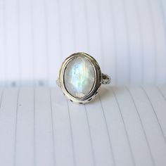 Rainbow moonstone ring, Sterling Silver ring, cocktail ring, alternative engagement ring, Rainbow moonstone jewelry, Valentine's day jewelry, silver jewellery Description: Be assured that the product you order is MADE JUST FOR YOU and is not a mass produced item. The gemstone is a pear shaped RAINBOW MOONSTONE The rest of the ring is made from 925 STERLING SILVER i.e 92.5% pure silver. And it DOESN'T HAVE ANY LEAD OR NICKEL. I make more than 50 DIFFERENT GEMSTONES. If you want other gemstones, P Fine Jewelry Moonstone Ring With Natural Stones For Gift, Mystical Iridescent Sterling Silver Jewelry, Silver Moonstone Ring Fine Jewelry For Gift, White Oval Cabochon Moonstone Ring, Ethereal Sterling Silver Jewelry, Bohemian Handmade Iridescent Rings, Unique Opal Ring With Moonstone, Handmade Silver Moonstone Ring Fine Jewelry, Ethereal Adjustable Silver Jewelry