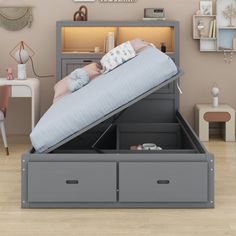 a child's bed with an open storage compartment underneath it in a living room