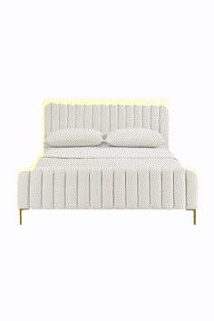 a white bed with two pillows on top of the headboard and one foot board