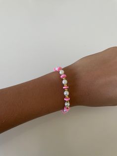 super cute, cool design, good for layering and/or wearing alone, includes pink clay beads, pearl beads, and small gold beads Pink Pearl Bracelet With Pearl Charm, Pink Everyday Bracelet With Round Beads, Trendy Pink Beaded Bracelets With Letter Beads, Everyday Pink Bracelets With Round Beads, Pink Pearl Bracelet Gift, Handmade Pink Pearl Bracelet, Pink Dainty Pearl Bracelet, Trendy Pink Beaded Bracelets With Heart Beads, Adjustable Pink Pearl Bracelet With Charm