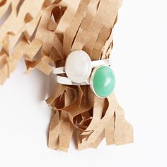 This exquisite ring features an oval gemstone that is bezel-set in either chrysoprase or moonstone. The Ascendant Gemstone Stacking Ring comes in two quality finishes - sterling silver or 14kt gold vermeil - both of which are perfect for any occasion. Chrysoprase is thought to promote feelings of optimism, joy, and happiness while also encouraging compassion, self-acceptance, and forgiveness. Moonstone is considered to be a stone of new beginnings and is believed to promote inner growth and stre Oval Jade Ring With Natural Stones, Modern Oval Jade Ring, May Birthstone Rings With Natural Stones, Modern Jade Ring As A Gift, May Birthstone Oval Rings With Natural Stones, Oval Rings With May Birthstone And Natural Stones, Oval Natural Stones Ring For May Birthstone, Oval Natural Stone Ring For May Birthstone, Minimalist Green Oval Stackable Rings