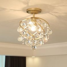 a chandelier hanging from the ceiling in a room