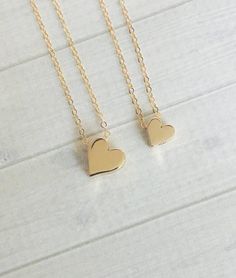 Mix and match these beautiful chunky bronze hearts for a perfect mother daughter(s) gift or purchase a single necklace in your choice of size.♥Large bronze heart measures approximately 3/8"♥Small bronze heart measures approximately 1/3"The necklaces will come hung on 18" long delicate gold filled cable link chains - if you need another size, please let me know.Your new necklace(s) will be beautifully and individually packaged all set to give.This set is also available in gold here:  https://www. Heart-shaped Gold Necklace For Best Friend, Gold Heart Pendant Necklace For Best Friend, Gold Double Heart Necklace Nickel Free, Nickel-free Gold Double Heart Necklace, Cute Gold Necklaces For Mother's Day, Cute Gold Necklace For Mother's Day, Gold Heart Necklace For Best Friend Gift, Gold Heart Necklace For Best Friend, Personalized Gold Heart Necklace Cute Style