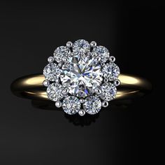 a diamond ring with an oval center surrounded by smaller round diamonds on a black background