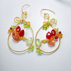 Indulge in the boho chic charm with these large teardrop multi gemstones earrings, featuring carnelian, sunstone, prehnite, citrine, garnet and peridot.  These handmade, colorful flower woven hoops make a unique gift for her. Perfect for any jewelry lover, these luxury gem wire-weaved earrings are a statement piece that blends whimsy with elegance. ▶️ Natural multi gemstone weaved earrings length - approx. 2.5 x 1.25 inch / 6,5x 3,2 cm ▶️ MATERIAL: ◾️ 18K gold plated textured wire and finish, ox Bohemian Teardrop Wire Wrapped Jewelry, Bohemian Wire Wrapped Teardrop Jewelry, Elegant Handmade Carnelian Jewelry, Bohemian Teardrop Jewelry With Ear Wire, Unique Wire Wrapped Dangle Jewelry, Bohemian Teardrop Amber Jewelry, Bohemian Amber Teardrop Jewelry, Bohemian Freeform Wire Wrapped Jewelry, Bohemian Orange Teardrop Jewelry