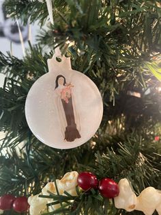 an ornament hanging from a christmas tree