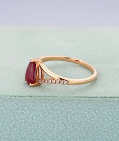 Ruby engagement ring in rose goldPear shaped wedding | Etsy Teardrop Brilliant Cut Promise Ring, Emerald Cut Ruby Ring With Diamonds For Anniversary, Teardrop Diamond Ring For Promise, Teardrop Brilliant Cut Diamond Promise Ring, Anniversary Ruby Ring With Moissanite In Round Cut, Teardrop Brilliant Cut Proposal Ring, Proposal Ring With Pear-shaped Brilliant Cut, Anniversary Ruby Ring With Round Cut Moissanite, Elegant Ruby Ring With Prong Setting For Proposal