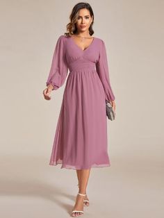 Step into any cocktail party or special event with confidence in this stunning Chiffon V-Neck Long Sleeves Elastic Band Midi Dress. The combination of the flowing chiffon fabric, v-neckline, and long sleeves exudes a classy and refined vibe. Complete your look with heels and accessories for a memorable appearance that will turn heads all night long. Solid V-neck Chiffon Dress, Flowy Chiffon V-neck Dress For Party, V-neck Chiffon Dress With Ruched Bodice, Solid Chiffon V-neck Dress, V-neck Chiffon Bridesmaid Dress, Flowy Solid Chiffon V-neck Dress, Flowy Solid Chiffon Dress With V-neck, Solid Color Flowy V-neck Chiffon Dress, Elegant Chiffon Surplice Neckline Dress For Party