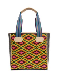 The Classic Tote has been our signature Consuela silhouette since the beginning. This bold and colorful embroidered tote bag holds its shape while carrying all of the essentials. You’re ready for anything that comes your way! Details & Sizing Rae embroidered pattern and Diamond exterior Lex woven side panels Interior slide pocket and zipper pocket Comfortable woven straps Trimmed in natural, untreated leather 13 ½” (W) x 13 ½” (H) x 5 ½” (D), 9 ¾" handle drop Made in Mexico Pattern placement may Multicolor Embroidered Woven Motifs Tote Shoulder Bag, Multicolor Embroidered Tote Shoulder Bag, Mexico Pattern, Mexican Handbags Tote Bags, Multicolor Floral Embroidered Tote Bag, Consuela Bags, Embroidered Tote Bag, Embroidered Tote, Brown Dog