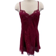 Features: * Vintage slip dress/chemise * Tags have been removed, but I believe it's approximately a medium * Maroon with floral jaquard print * Lace trim * Adjustable straps * Chemise * Floral * Made in Unknown * Machine wash * Gently used condition Size: Womens M Measurements: Across Bust: 17 in / 43 cm Across Waist: 15.5 in / 39 cm Across Hips: 18.5 in / 47 cm Length: does not include strap length 29.5 in / 75 cm Condition: Pre-Owned Good Tags have been removed. I would say it's approximately a medium Fitted Lace V-neck Chemise, Coquette Lace Slip Dress For Night, Sleeveless Lace Slip Dress With Built-in Bra, Lace Slip Dress With Built-in Bra, Fitted Lace Slip Dress In Coquette Style, Sleeveless Lace Chemise For Sleep, Sleeveless Lace Chemise With Built-in Bra, Lace Cami Dress With Built-in Bra, Lace Camisole Dress In Coquette Style