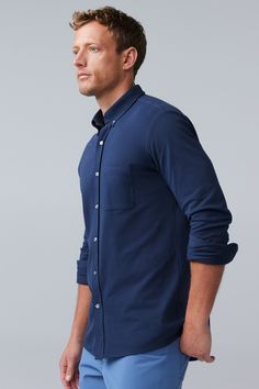 Looks like a button up, feels like anything but. With its light and stretchy texture, this shirt has all the style of a traditional Oxford—and none of the stiffness. Mack Weldon offers the best and most comfortable premium clothing for anything from working out to casual living. Our incredibly soft and smooth fabric will change your outlook on men's clothing. Come see why we are the one of the top luxury comfort clothing brands | SILVER Pique Button Up in Chambray, Size: XL | Mack Weldon Classic Solid Color Shirt For Casual Gatherings, Comfort Clothing, Clothing Brands, Sweater Shop, Chambray, You Changed, Men's Clothing, Feel Like, Clothing Brand