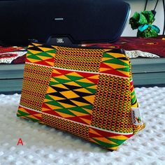 African Print Cosmetic | Make Up Bags | Purse | Mother's Day | The bold statement piece like all my other products is hand crafted by myself. Colurful and sturdy; great for carrying all your essentials. *Zipper for easy access *African Wax Print *Interfacing (for sturdiness) *100% cotton   MEASUREMENTS COSMETIC BAG Width at widest point 10 inches (26cm) Height 6 inches (16cm) Depth at widest point 3 inches (8cm) MEASUREMENTS FOR TRIANGLE ZIPPER - inch) Width at widest point 6 inches Height 6 inc African Hats, Handmade Fabric Bags, Make Up Bags, Diy Bags Patterns, Sewing Bee, Bag Obsession, African Mud Cloth, African Wax Print, Small Pouches