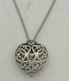 "Beautiful 3D Filigree Heart Pendant Sterling Silver 925 Italy 18\" Necklace Pendant Height: 1\"  Pendant Width: 1\" inch Pendant Weight: 5 grams Necklace Length: 18\" Necklace Weight: 3 grams Stamped: 925 Italy Original Patina, This item will not and has not been cleaned Item will arrive as pictured This Item has been acid tested to confirm it is real Sterling Silver  10% restocking fee on returns  Metal Purity925 parts per 1000 MetalSterling Silver" Silver Round Heart Necklace For Valentine's Day, Silver Heart Locket Necklace For Valentine's Day, Valentine's Day Silver Heart Locket Necklace, Silver Double Heart Jewelry With Hallmark, Silver Heart Necklace With Hallmark, Silver Heart Pendant Jewelry With Hallmark, Silver Heart Shaped Necklace With Hallmark, Silver Hallmarked Heart Necklace For Valentine's Day, Formal Silver Sterling Heart Necklace