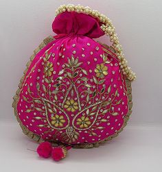 "ethnic traditional indian wedding gota patti zardosi embroider potli bag handbag for woman | potli bag for return gift | indian wedding gift Package Contents: 1 Size: 10\" x 8\" Designed with the heart, this beautiful Potli or batawa bag are eye catchy and made of premium material. Key Features: Ark Work. This potli is good match with both Indian and western outfits and are superb for wedding and festive parties. This would be best complement to your designer saree, lenhga or any other kind of Festive Mirror Work Potli Pouch Bag, Festive Mirror Work Pouch Potli Bag, Festival Mirror Work Pouch Potli Bag, Festive Potli Bag With Mirror Work, Festive Pouch Potli Bag With Mirror Work, Pink Bag With Zari Work For Gift, Pink Bags With Zari Work For Gift, Gold Bag With Mirror Work For Gift, Gold Bags With Mirror Work For Gifts