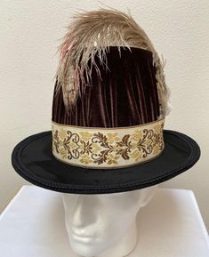 New Renaissance Medieval Victorian Elizabethan colonial men's brown velvet tall hat cap costume. This velvet brown crown is 6" tall with a heavy black felt 2 1/4 " brim. 2 1/4" tan brocade band. Inside size adjustable headband for more comfort.    New not worn. Size large -X large. Great for your next theme party, stage production or special event.  Sales final. Princess Hat Medieval, Medieval Hats Women, Tudor Bonnet Hat, Brandon Jackson, 14th Century Hats For Men, Medieval Hats Medieval Collectibles, Medieval Hats, Tall Hat, Felt Crown