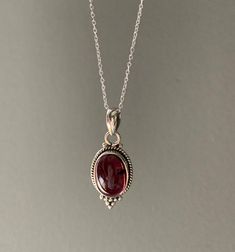 Sterling silver teardrop Garnet necklace. Ideal gift for her.Matching earrings available. Silver Drop Jewelry For Mother's Day, Sterling Silver Teardrop Necklace For Mom, Sterling Silver Teardrop Necklace As Gift For Mom, Sterling Silver Teardrop Necklace For Her, Teardrop Sterling Silver Necklace As Gift For Her, Teardrop Hallmarked Necklace As A Gift, Dainty Silver Drop Necklace Gift, Oval Gemstone Drop Necklace As Gift, Oval Sterling Silver Necklace For Mom