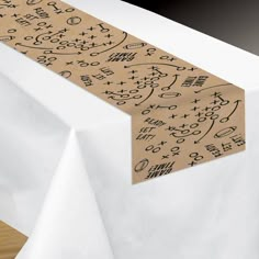 a white table topped with a brown paper banner