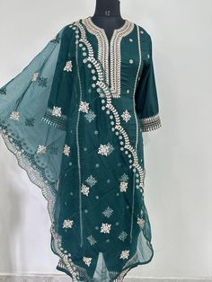 Salwar Kameez Set/Dresses For Women/Indian Wedding Dress/Pakistani Suit/ Kurta Palazzo Set / Kurtis for Women/ Silk Kurta Set Product Details Green Embroidered Kurta with Trousers with dupatta Kurta design: * Embroidered . Straight shape * Regular style *Round neck, three-quarter regular sleeves *l pocket zari detail * Calf length with straight hem * Chanderi silk machine weave fabric Trousers design: * Solid Trousers Partially elasticated waistband *Slip-on closure Material & Care Kurta Fabric: Silk Blend  Trouser Fabric: Silk Blend Dupatta Fabric: Organza Hand Wash items includes One piece Kurta One piece Dupatta One piece Trouser Note:- Please see the size chart in the image to choose a perfect size. Please feel free to ask any questions regarding this item WE ALSO ACCEPT CUSTOMISATION Green Embroidered Party Kurta, Party Green Embroidered Kurta, Fitted Embroidered Mulmul Sharara, Summer Festive Anarkali Set With Gota Work, Fitted Embroidered Chinon Salwar Kameez, Fitted Festive Unstitched Mulmul Suit, Summer Embroidered Anarkali Set In Georgette, Fitted Mulmul Sharara With Zari Work, Summer Festive Unstitched Suit With Dabka Work