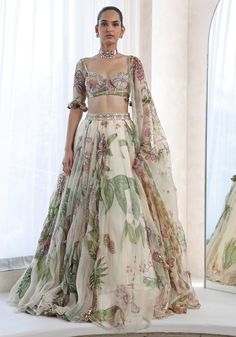 Buy Ivory Floral Printed Lehenga Set by Mahima Mahajan at Fabilicious Fashion! Shop made-to-measure Indian wedding wear and jewellery with fast shipping to USA, UK, and Canada. Ivory Lehenga, Mahima Mahajan, Lehenga Style Saree, Indian Bridesmaid Dresses, Sangeet Outfit, Simple Lehenga, Printed Lehenga, Floral Lehenga, Classic Blouse