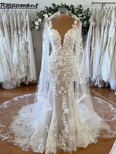 a white wedding dress on display in a store