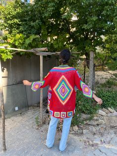 in stock! Granny square red boho style patchwork cardigan vest is combined with inspiration from the rainbow. :) The yarn used in the cardigan is cotton. It will be a unique gift to have a wonderful product for your loved ones for their birthdays and special occasions! Be the sparkle of your festivals and parties! Cardigan Sizes Width 110 cm / 43.3 inches Height 75 cm / 29.5 inches Model Size: 178 cm / 5 Feet 10.79 Inches / 63 kg - 138 lb. washing information It can be washed in the hand wash pr Red Long Sleeve Cardigan For Festivals, Bohemian Red Long Sleeve Cardigan, Red Bohemian Long Sleeve Cardigan, Red Bohemian Outerwear For Festival, Red Bohemian Festival Outerwear, Bohemian Red Crochet Cardigan, Red Bohemian Cardigan With Crochet Details, Red Bohemian Crochet Cardigan, Bohemian Patchwork Beach Outerwear