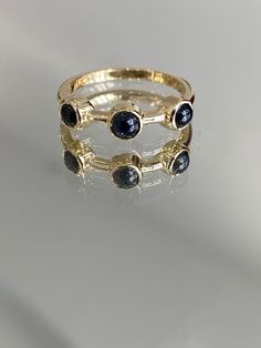 Custom Luxury Ladies Womens Solid 18K Karat Yellow Gold Triple Trilogy Cabochon Cut Blue Sapphire Stackable Band Statement Ring Bridal Gift Estimated Total Gram Weight: 3.0 grams Ring Size: 6 US (available in every finger size  Trilogy cabochon cut blue sapphire approximately 3.45mm diameter Blue Cabochon Sapphire Ring In 14k Gold, 14k Gold Blue Three Stone Jewelry, Gold Cabochon Sapphire Ring In 14k Gold, Blue Three Stone Round Jewelry, Gold Sapphire Cabochon Ring, Gold Jewelry With Cabochon Round Cut, Formal Blue Three-stone Jewelry, Gold Sapphire Three Stone Jewelry, Gold Sapphire Ring With Round Stone For Formal Occasions