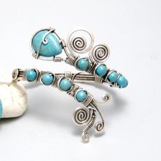 Looking for glorious turquoise jewelry? This turquoise cuff bracelet is perfect. This lightweight turquoise bracelet are a lovely addition to any wardrobe. It is suitable has an elegant, rustic look to it. This is really striking bracelet for every occasion. This turquoise cuff bracelet is formed using traditional wire wrapping techniques and has been oxidized to give it a more antique and magical look. I will cover it with special lacquer for metals. That will help to keep this bracelet bright Hand Wrapped Turquoise Bangle, Turquoise Wire Wrapped Bangle Cuff Bracelet, Adjustable Turquoise Cuff Bracelet Wire Wrapped, Turquoise Wire Wrapped Cuff Bracelet, Wire-wrapped Turquoise Cuff Bracelet, Turquoise Hand Wrapped Cuff Bracelet, Bohemian Turquoise Wire Wrapped Cuff Bracelet, Blue Bohemian Wire Wrapped Cuff Bracelet, Unique Nickel-free Turquoise Cuff Bracelet