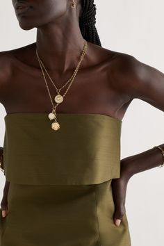 Foundrae's pieces are centered around symbols that connote strength and wellness. This 18-karat gold necklace is strung with two charms - the diamond-encrusted 'Mind Body Soul' pendant represents generations of powerful women, while the enameled 'Wholeness' one is bordered by an ouroboros to signify rejuvenation. Luxury Gold-tone Jewelry With Pearl Pendant, Elegant Gold Charm Necklaces With 17 Jewels, Luxury Gold-tone Pendant Charm Necklaces, Luxury Gold Plated Medallion Charm Necklaces, Luxury Gold-tone Charm Jewelry, Gold-tone Necklace With Detachable Pendant For Formal Occasions, Timeless White Gold Necklaces With Charms, Luxury Gold Chain Necklace With Pearl Charm, Refined Gold Jewelry With Pearl Pendant