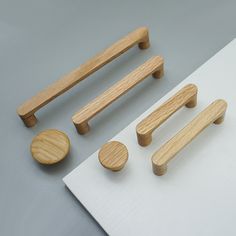 wooden handles and knobs on a white surface