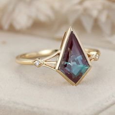 Experience the timeless elegance of our Kite Cut Lab Alexandrite Engagement Ring, set in vintage-inspired 14K solid gold with unique diamond accents. This exquisite ring features a captivating lab-grown alexandrite stone, known for its stunning color-changing properties, paired with sparkling diamonds. Perfect for engagements, weddings, promises, and anniversaries, this ring is a beautiful symbol of love and commitment. Timeless 14k Gold Emerald Wedding Ring, Fine Jewelry Marquise Topaz Wedding Ring, Fine Jewelry Marquise Topaz Ring For Wedding, Marquise Topaz Ring For Wedding, Fine Jewelry, Emerald Cut Birthstone Ring With Diamond Accents For Wedding, Marquise Topaz Ring For Wedding, Exquisite Ruby Ring With Accent Stones For Wedding, Timeless Emerald-cut Birthstone Ring For Weddings, Timeless Emerald Ring With Accent Stones For Wedding