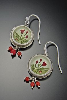 Round Poppy Earrings by Ananda Khalsa. A bright burst of red color wonderfully contrasts sterling silver in both the hand-painted acrylic image and coral beads of these enticing earrings. Artistic Red Enamel Jewelry, Artistic Red Jewelry For Jewelry Making, Unique Red Jewelry With Artistic Design, Artisan Red Jewelry With Artistic Design, Elegant Red Hand Painted Jewelry, Red Hand Painted Drop Earrings, Hand Painted Red Elegant Earrings, Elegant Hand Painted Red Earrings, Red Hand-painted Dangle Earrings