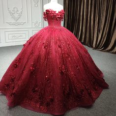 Make a bold statement and shine with regal beauty in this Exquisite Red Quinceanera Dress. This dress is crafted from luxurious red tulle, the ball gown silhouette offers a voluminous and elegant fit, flowing effortlessly into a stunning cathedral train that trails behind you for added drama and sophistication. The strapless neckline creates a timeless, classic look, drawing attention to your shoulders and neckline, while the sleeveless design ensures both comfort and grace. The gown’s standout Red Debut Dress, 18th Debut Dress, Burgundy Quince Dress, Dark Red Quinceanera Dresses, Red Quinceanera Dress, Quinceanera Dresses Red, Debut Dresses, Quinceanera Dresses Gold, Quince Dresses Red