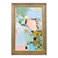 an abstract painting in gold frame on a white wall with green leaves and blue sky