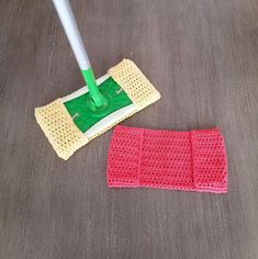 a mop is laying on the floor next to a sponge