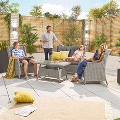 a group of people sitting around a table on top of a patio