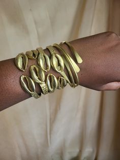 Raw Brass Cowrie Shell Bangle  Textured hammered finishes  Adjustable to fit size Cowrie Shell Tattoo, Jóias Body Chains, Afro Jewelry, Cowrie Shell Jewelry, Dope Jewelry Accessories, Cool Accessories, The Bangles, Jewelry Accessories Ideas, Dope Jewelry