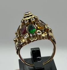 This gorgeous Vintage 18k Gold Princess Ring with Diamonds,Sapphire, Ruby Etc. size 6.9, weight 6.9grams. Collectible 14k Gold Multi-stone Rings, Collectible Multi-stone 14k Gold Rings, Unique Gold Sapphire Ring Hallmarked, Gold Multi-stone Oval Sapphire Ring, Gold Oval Sapphire Ring With Multi-stones, Gold Multi-stone Sapphire Ring With Oval Shape, Yellow Gold Multi-stone Ruby Ring, Unique Multi-stone Ruby Ring In Yellow Gold, Multi-stone Ruby Ring In Yellow Gold