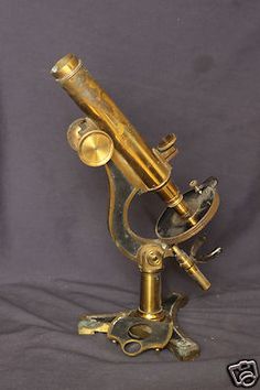 an old brass telescope on a stand