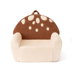 a brown and white chair with polka dots on it